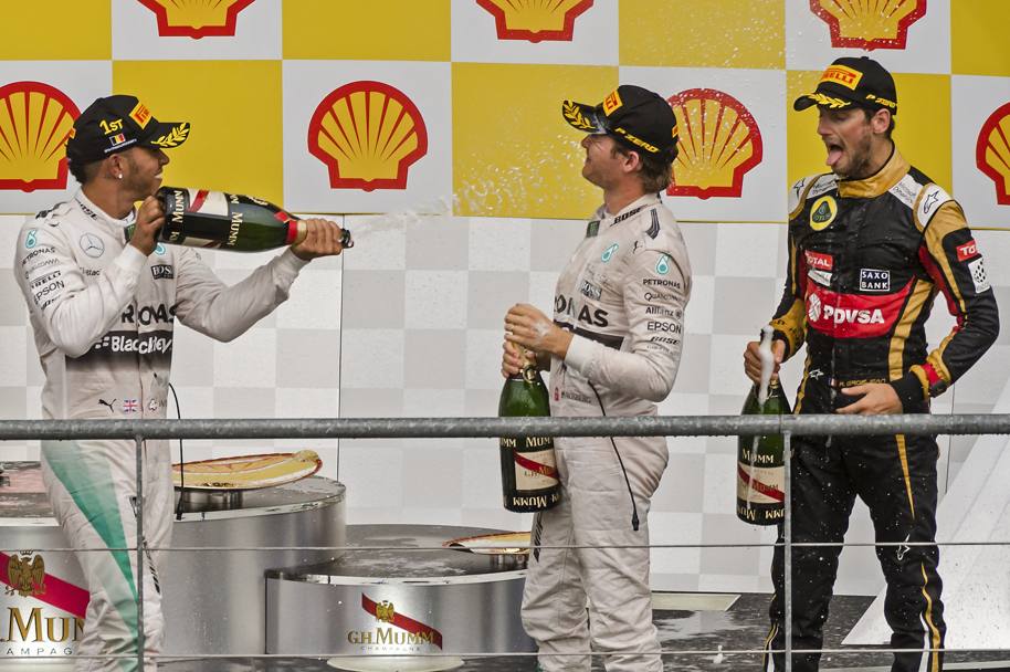 Il podio di Spa, da sinistra Hamilton (1.), Rosberg (2.) e Grosjean (3.). Ap 